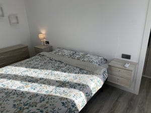 154LP Alhambra Park Home | Image of a bed with grey cover