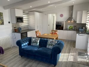 154LP Alhambra Park Home | Image of the lounge with a blue sofa