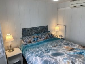 64LP Atlas Solitaire | Image of the double bed with side lights